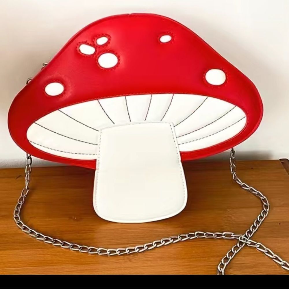 Mushroom shaped cross body purse with Kawaii chain. Plus free mushroom earrings.